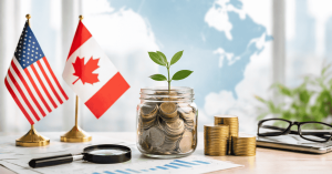 Investment concept image featuring U.S. and Canadian flags on a desk, with a glass jar filled with coins and a small green plant growing from the top, symbolizing financial growth. Nearby are stacked gold coins, a magnifying glass, financial charts, eyeglasses, and a laptop. A blurred map of North America appears in the background, representing cross-border investing and long-term financial planning in the United States and Canada.
